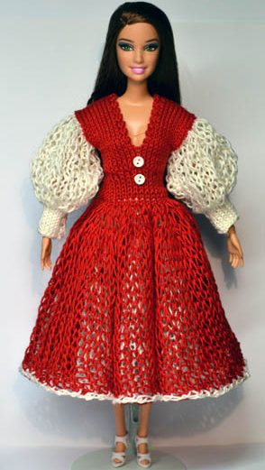 Barbie iklädd stickad röd klänning med vita puffärmar