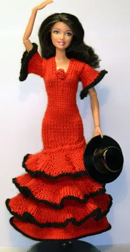 Barbie i röd stickad flamencoklänning med svarta detaljer och volanger.