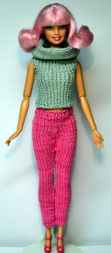 Barbie i grön stickad turtleneck-topp och cerise-rosa stickade byxor.