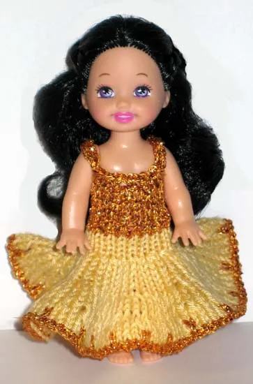 Barbie i gul klänning med glittrig guldöverdel.