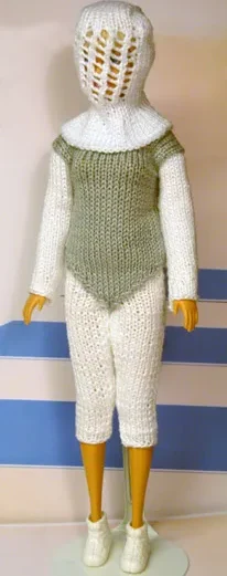 Barbie i vit stickad fäktdräkt med grön väst och vit mask.